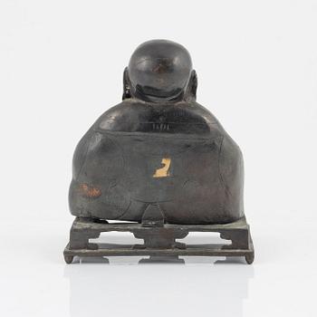 A bronze figure of Buddai, Qing dynasty (1664-1912).