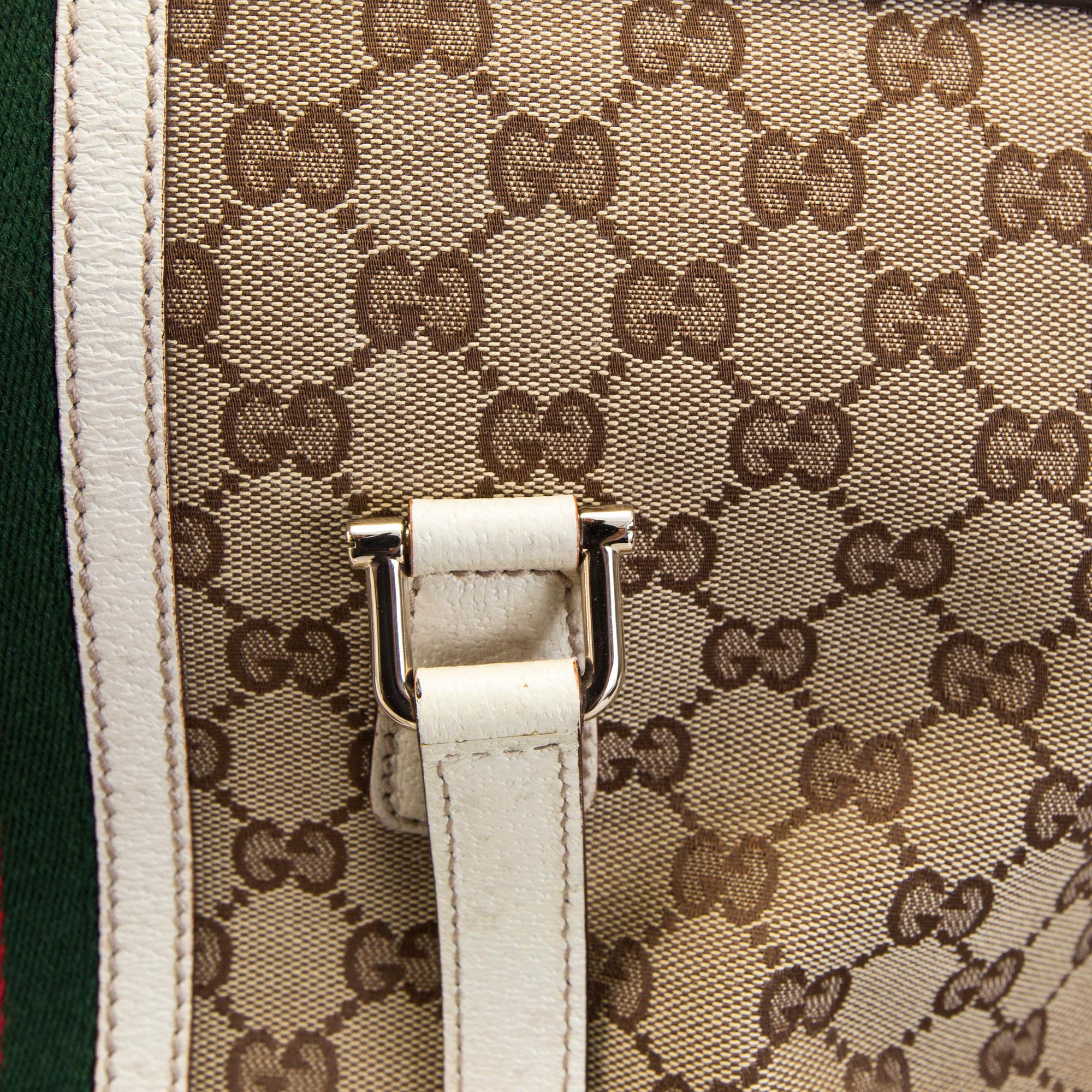 A Gucci canvas and leather hand bag.