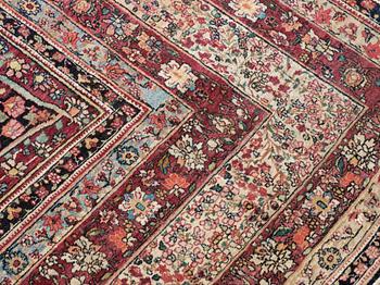 An antique Kerman Laver carpet, c. 586 x 385 cm.
