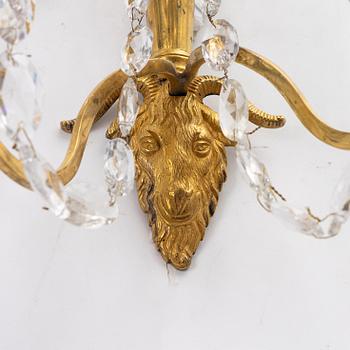 A pair of late Gustavian ormolu two-branch lustres, circa 1800.