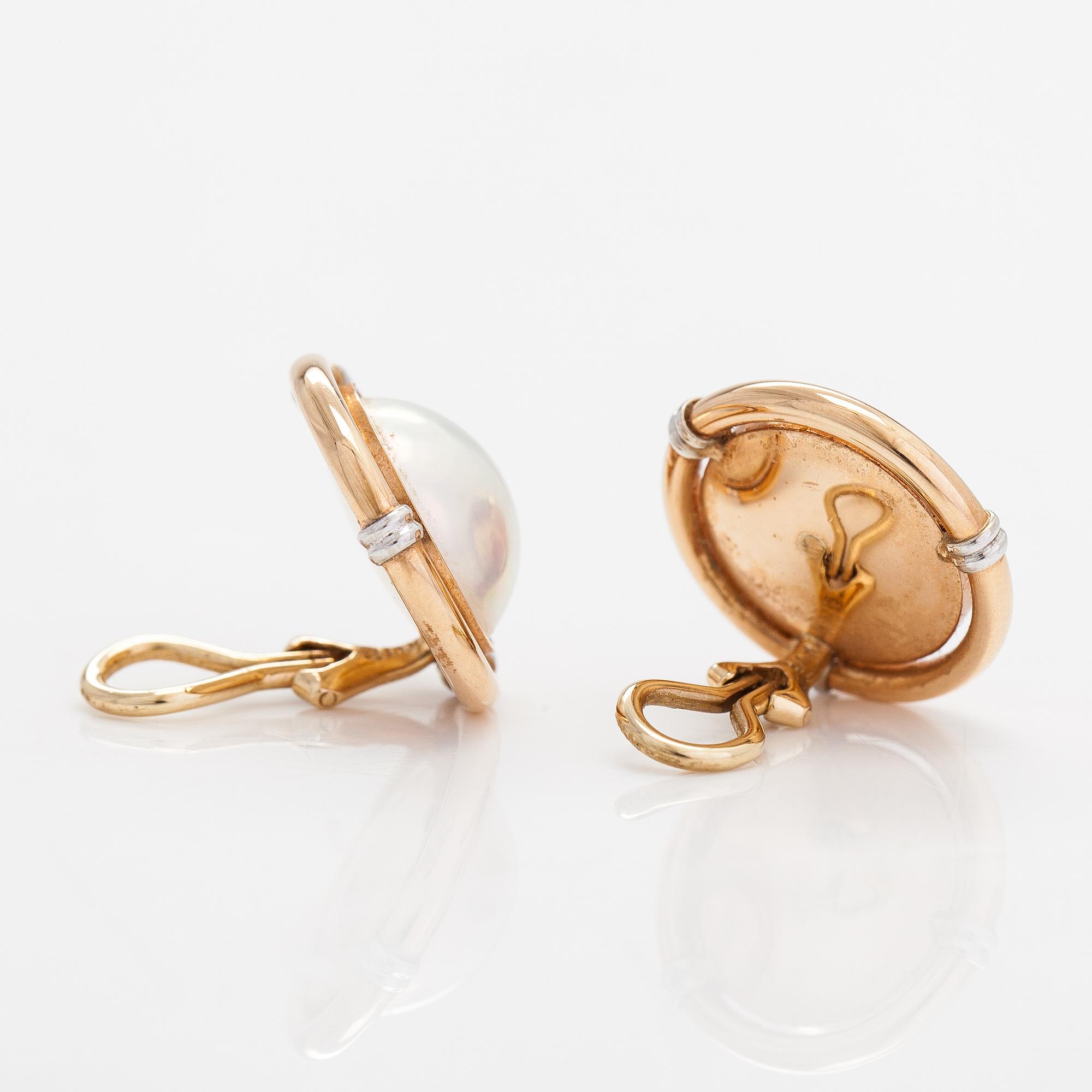 A pair of 14K gold and mabé pearl earrings.