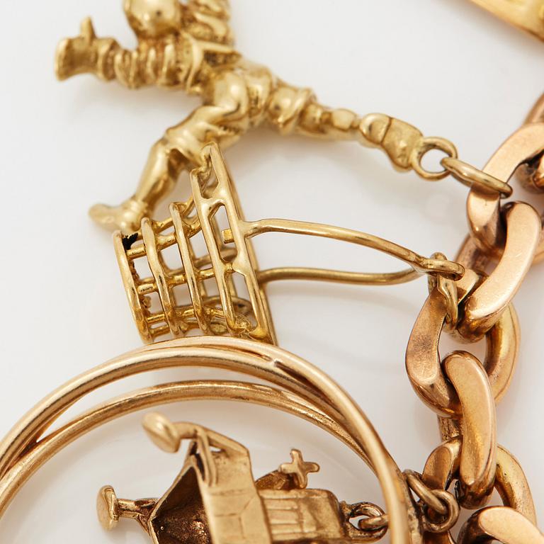 An 18K gold charm bracelet.