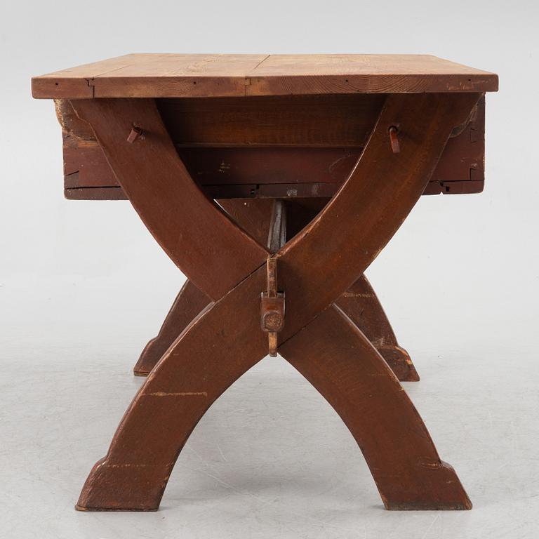 A Swedish folk-art trestle table from Dalarna, dated 1854.