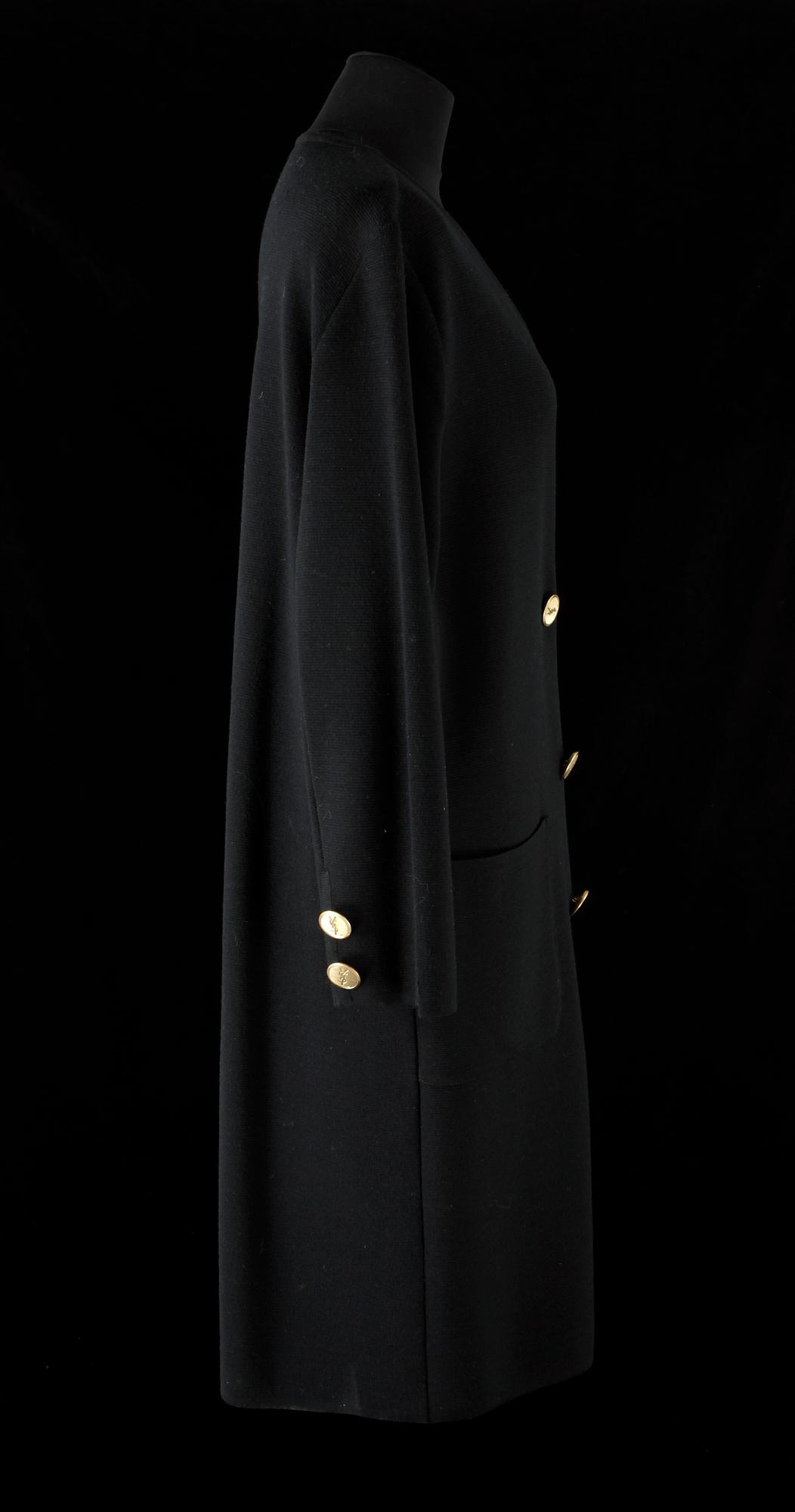 A 1970s black knitted wool coat dress by Yves Saint Laurent.