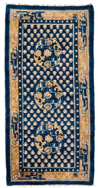 A RUG, an antique Ningxia, ca 137 x 67,5 cm, China, late Qing.