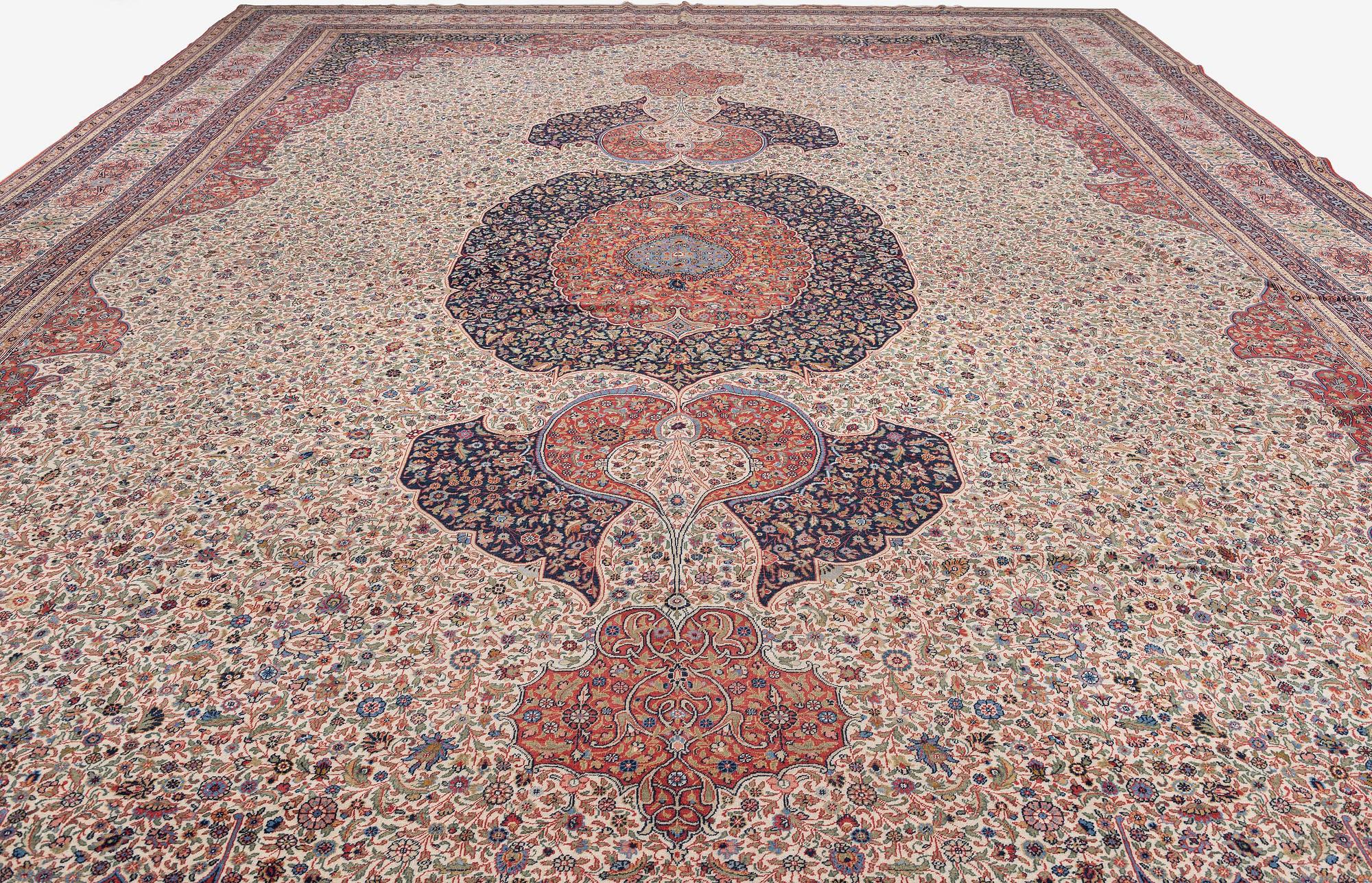 A semi-antique Hereke carpet, Western Turkey, c. 685 x 489 cm.