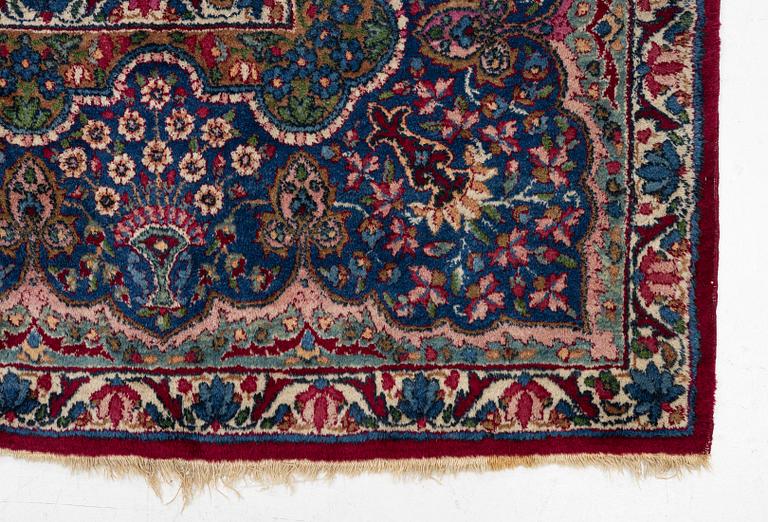 A Kerman carpet, c. 365 x 265 cm.