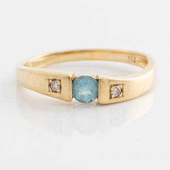 Ring, gold with topaz and two small brilliant-cut diamonds.