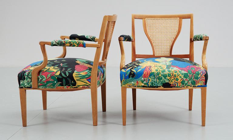 A pair of Josef Frank mahogany and rattan armchairs, Svenskt Tenn,