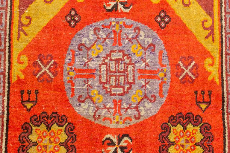 A Carpet, Khotan (?), 217 x 108 cm.