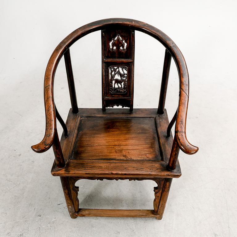 A pair of Chinese hardwood armchairs, circa 1900.