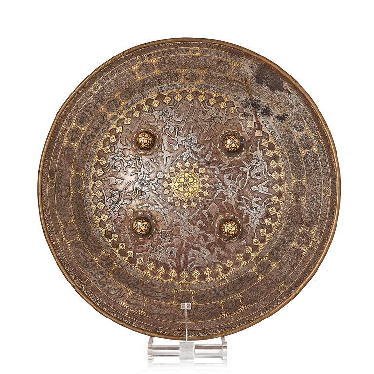 A gold-damascened steel shield, Qajar Iran, 19th century.