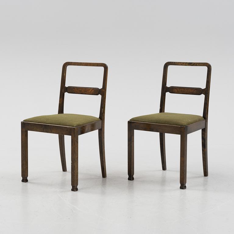 A Swedish Grace birch dining table and four chairs, 1920's/1930's.