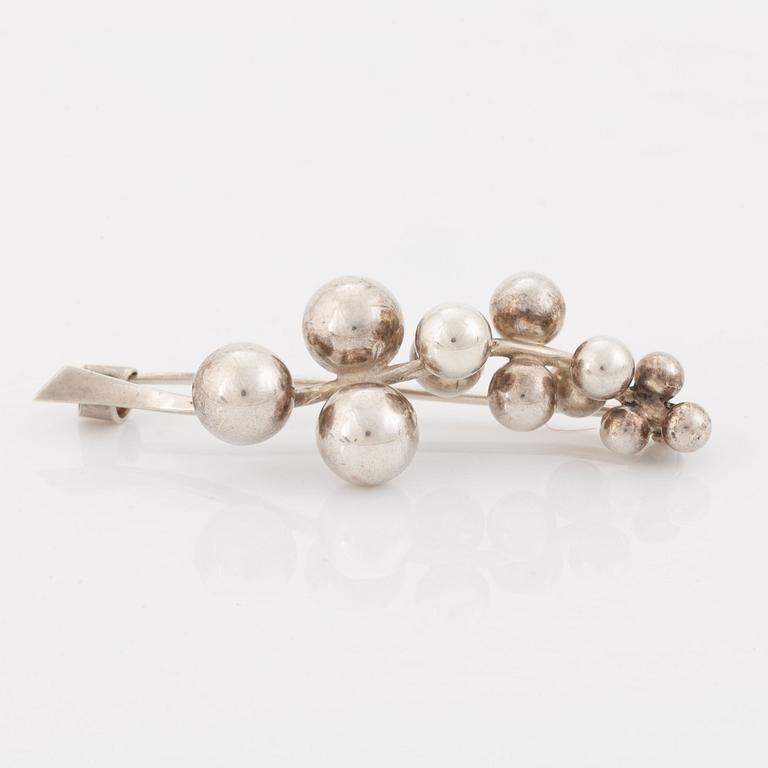 John L Denmark, brooch, silver.