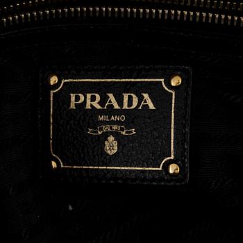 Prada, A black leather and gold stud bag.