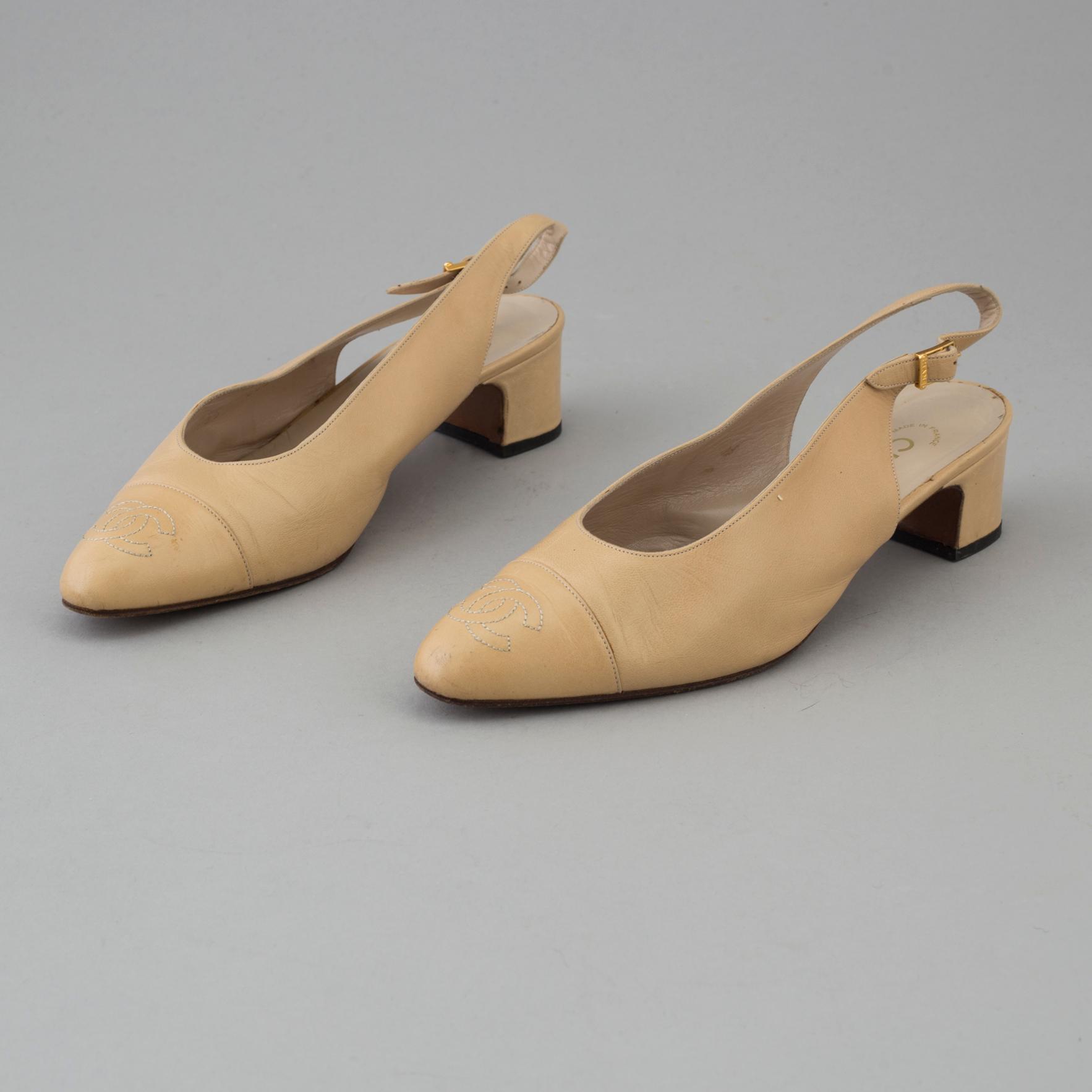 Beige leather slingbacks by Chanel.