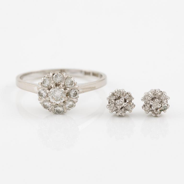 A ring and a pair of earrings in 18K white gold set with round brilliant-cut and octagonal-cut diamonds.