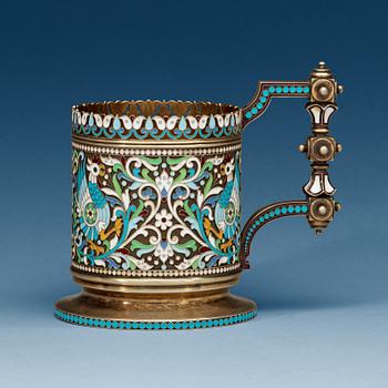 862. A Russian silver-gilt and enamel tea-glass holder, makers mark of Chlebnikov, Moscow 1892. Imperial Warrant.
