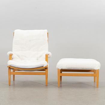 BRUNO MATHSSON, an "ingrid" armchair and stool for Dux. Late 20th century.