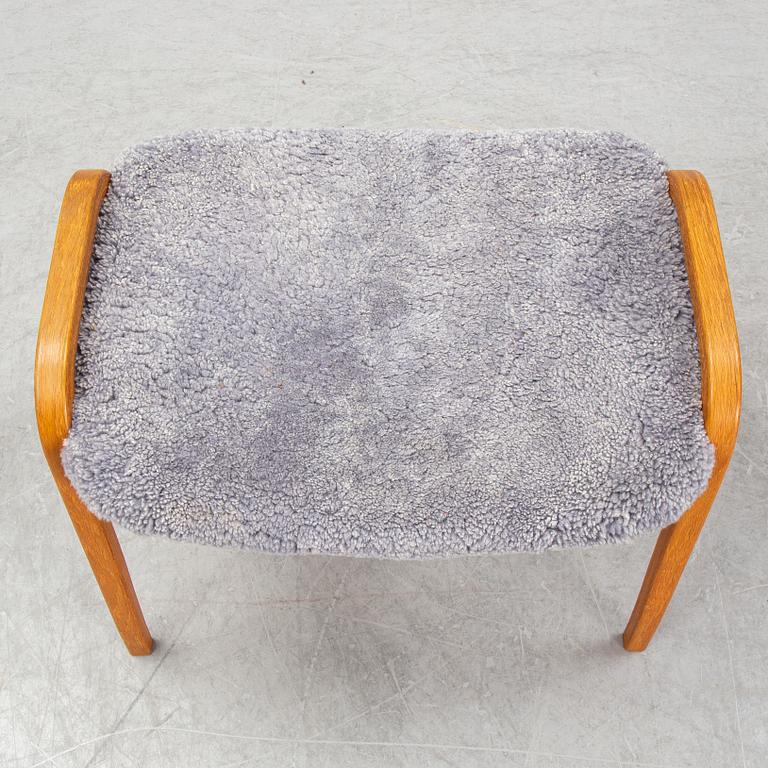 Yngve Ekström, a 'Lamino'  shearling upholstered lounge chair and foot stool from Swedese.