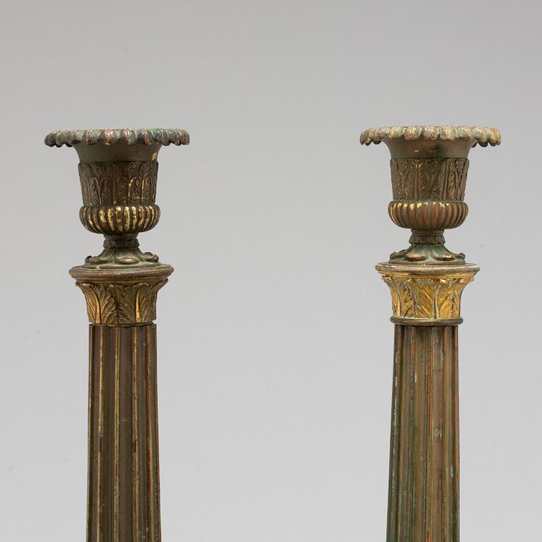 A pair of bronze gustavian candlesticks, late 18th century.