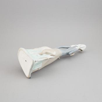 A Lladro porcelain figure of a lady with a dog, Spain, 20th Century.