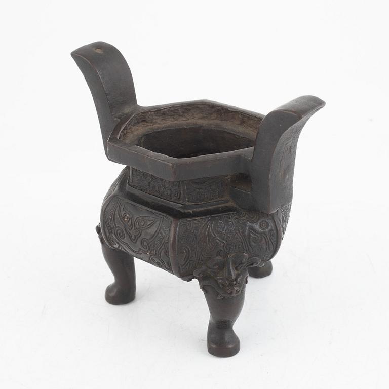 A Chinese bronze tripod censer, Ming dynasty (1368-1643).