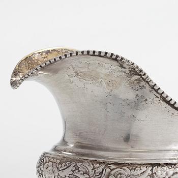 A silver coffee pot, and silver cream jug, Olof Robert Lundgren, Turku 1847 and Fredrik Strömsten, Helsinki 1839.