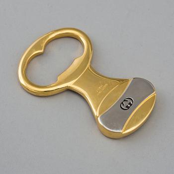 GUCCI, flasköppnare.
