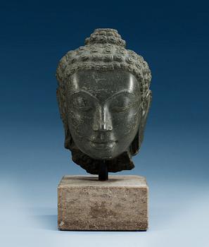 A stone head of Buddha. Thailand.