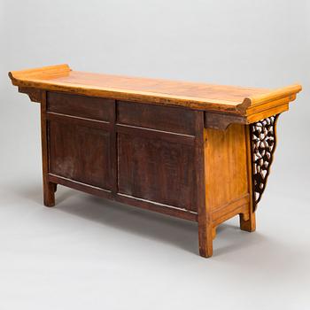 A Chinese elmwood sideboard, from around the turn of the century 1900.