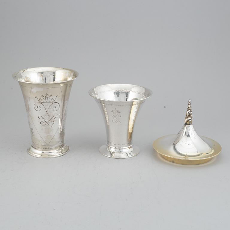 Two silver and parcel-gilt beakers and a parcel-gilt lid, maker's mark K. Andersson, Stockholm, 1927, 1922 and 1948.