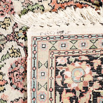 An oriental silk carpet ca 140x87 cm.