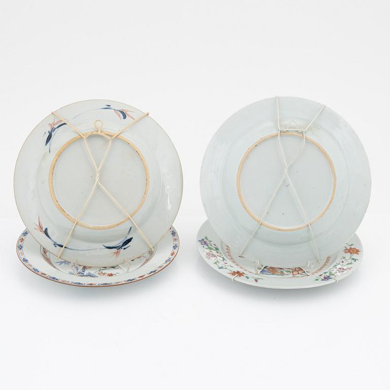 A set of four (2+2) famille rose dinner plates, Qing dynasty, 18th Century.