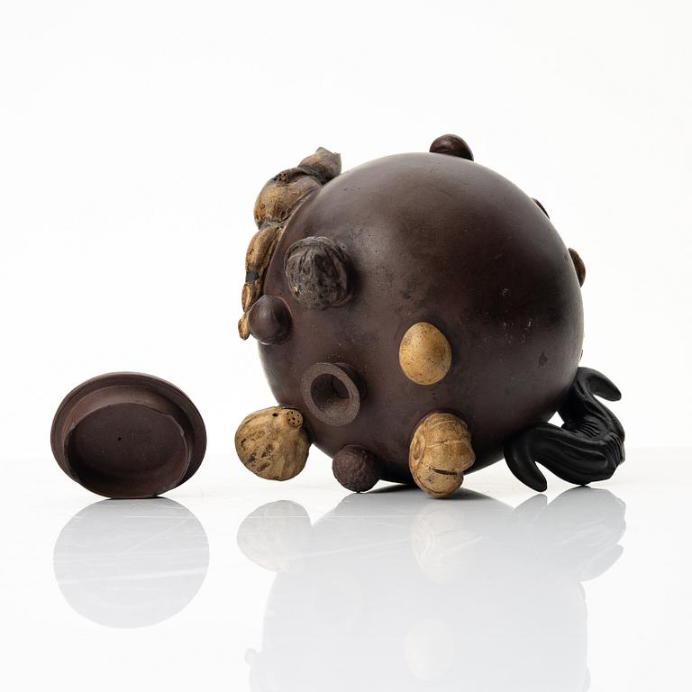 A Chinese 'hundred-fruit' yixing teapot, Qing dynasty (1644-1912).