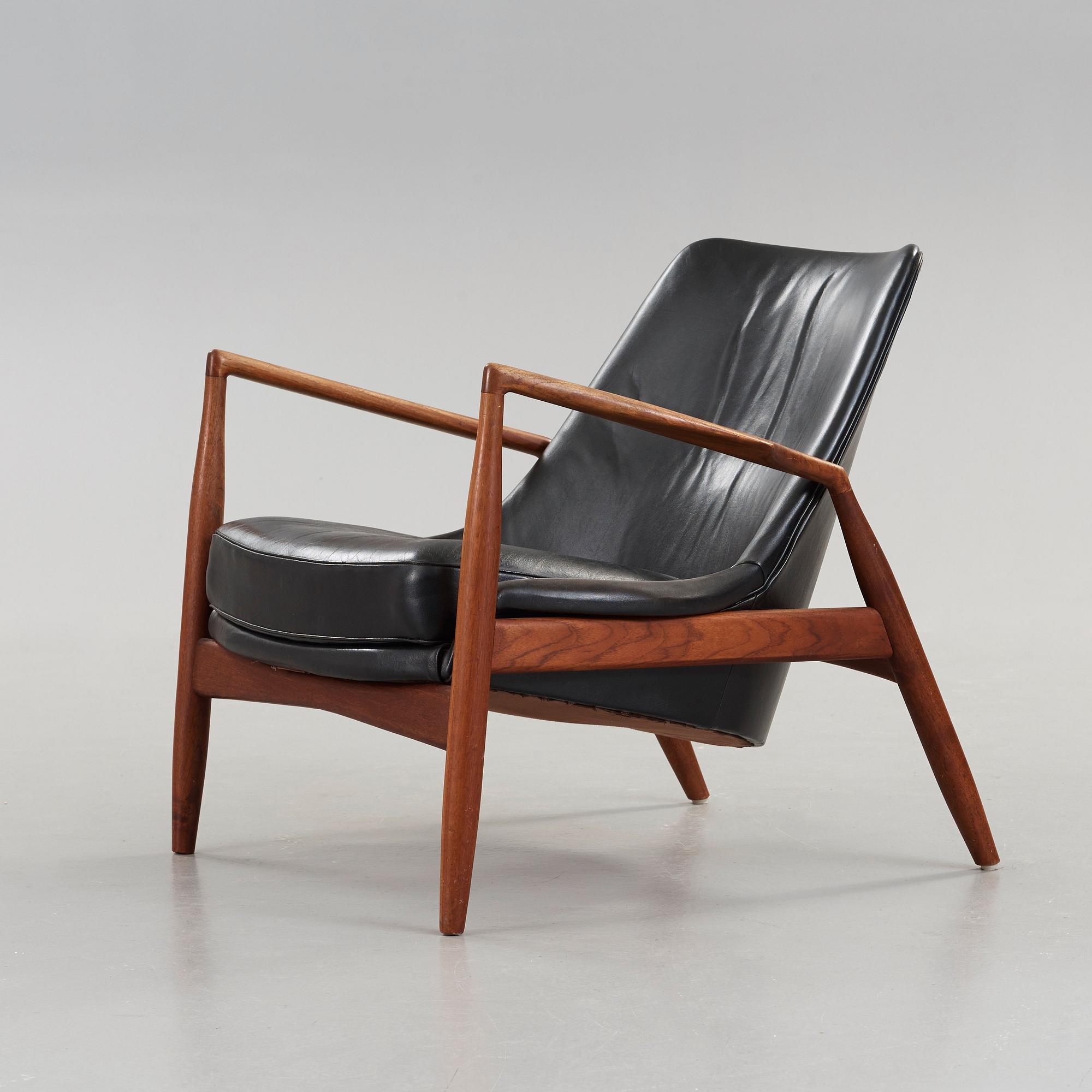 Ib Kofod-Larsen, a 'Seal' teak and black leather armchair, Olof Persson Möbler, Jönköping, Sweden 1950's-60's.