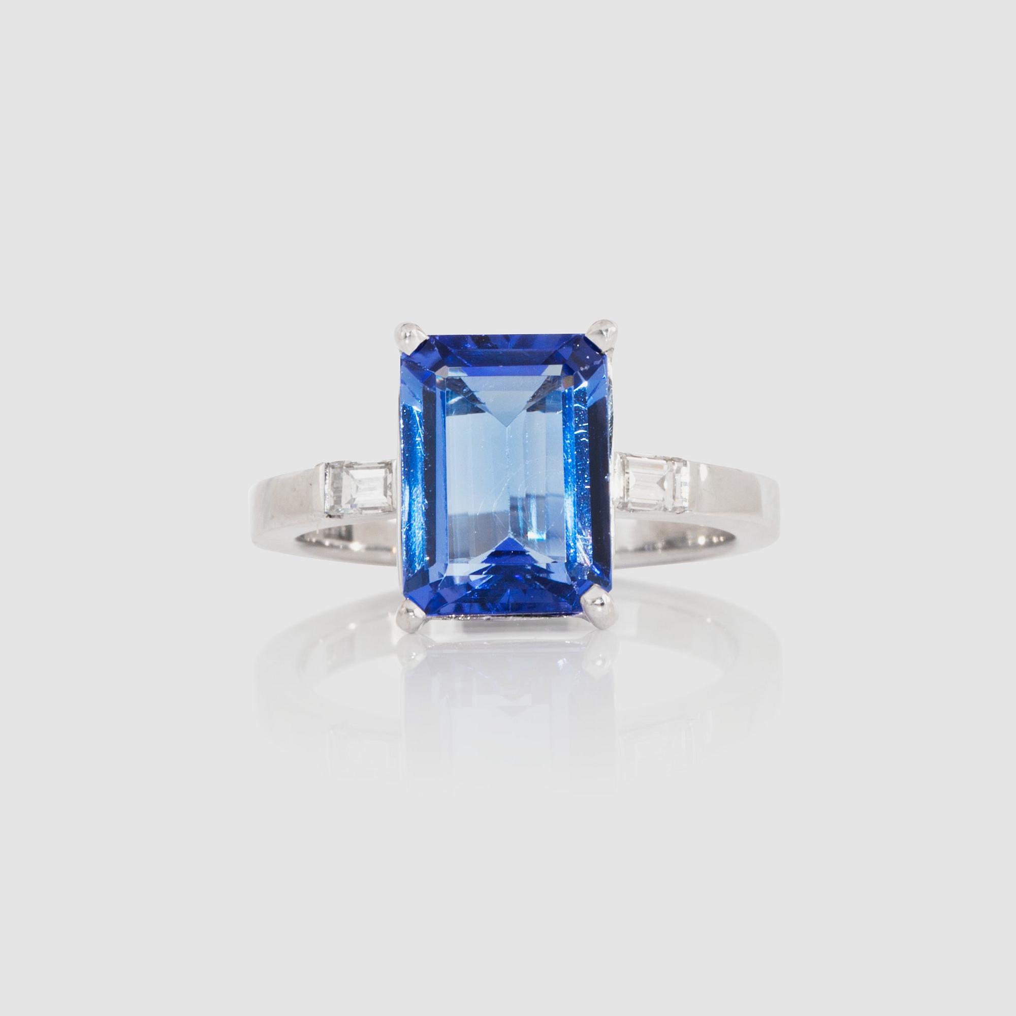 A 4.04 ct tanzanite ring set with diamonds, total carat weight 0.22 ct.