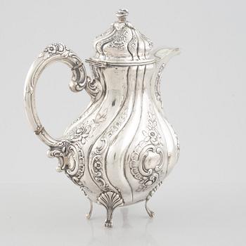 A Rococo-style silver coffee pot, creamer and sugar bowl, 20th Century.