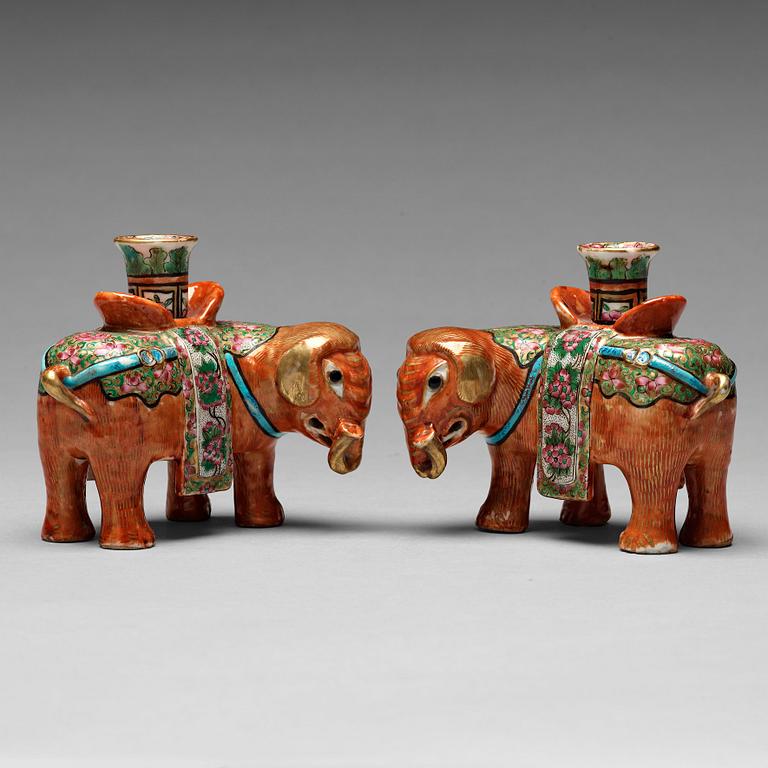 A pair of Canton candle sticks in the shape of elephants, Qing dynasty, 19th century.