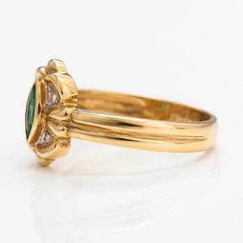 An 18K gold ring with diamonds ca. 0.02 ct and an emerald. Finnish import marks.
