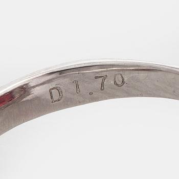 A platinum ring with spinel and brilliant cut diamonds.