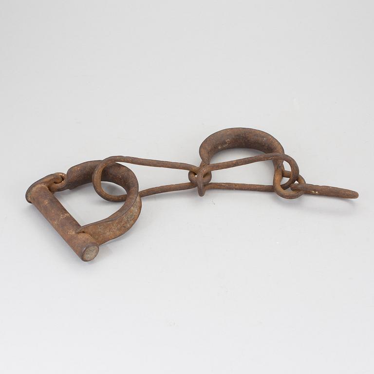 A pair of 1800s handcuffs.