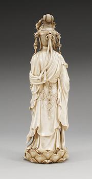 A Japanese ivory figure of Guanyin, probably Meiji period (1868-1912). Signed.