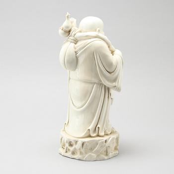 A blanc de Chine porcelian figurine of buddai, 20th Century.