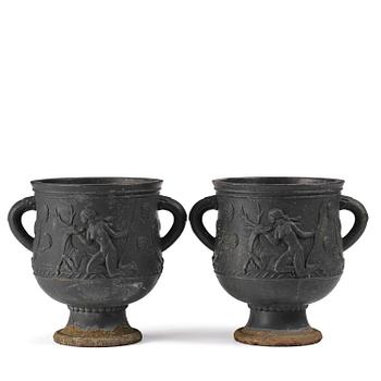 138. Ivar Johnsson, a pair of cast iron "Diana" urns, Näfveqvarns bruk, Swedish Grace.