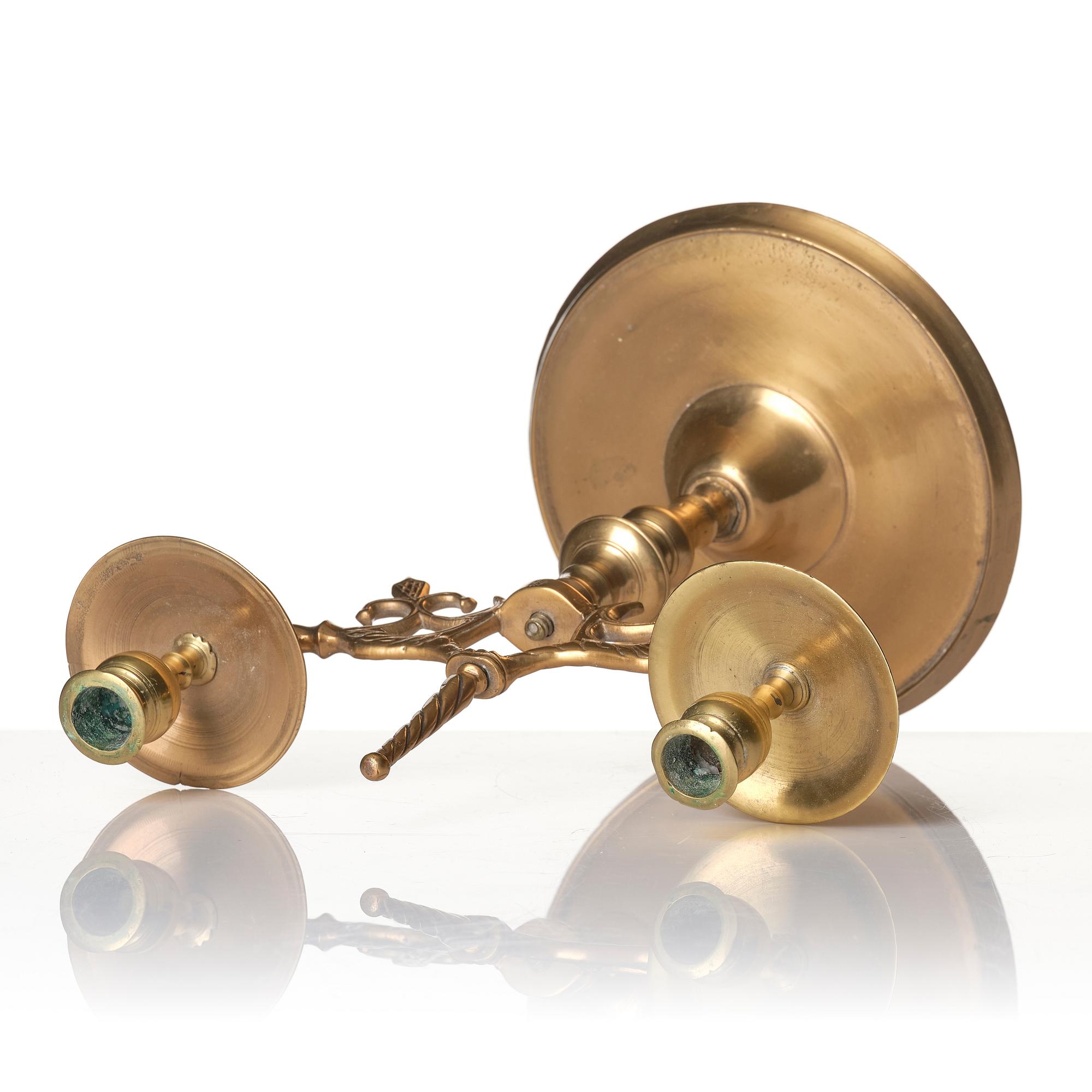 A baroque brass two-branch candelabra, Northern Europe/Sweden, 17th century.