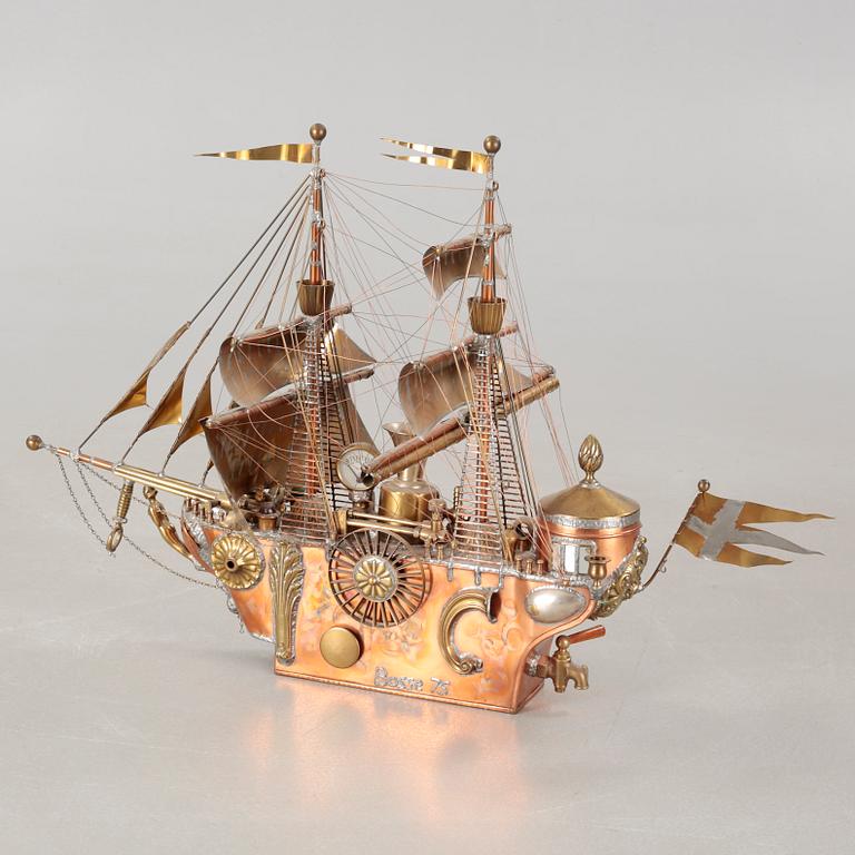 A boat sculpture, dated -75.