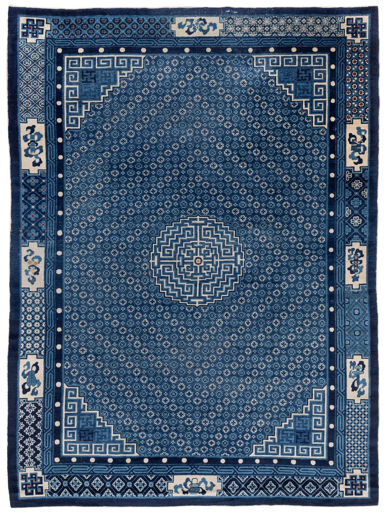 A semi-antique Baotou carpet, West China, c. 335 x 246 cm.