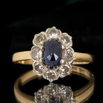 RING, 18k guld med diamanter totalt ca 0,50 ct, och blå sten. Hugo Strömdahl Stockholm, 1951. Vikt ca 2 gram.