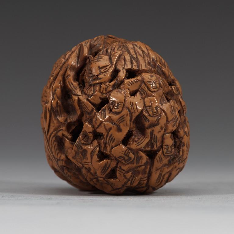 A set of six carved walnut hand exercisers, late Qing dynasty (1644-1912).